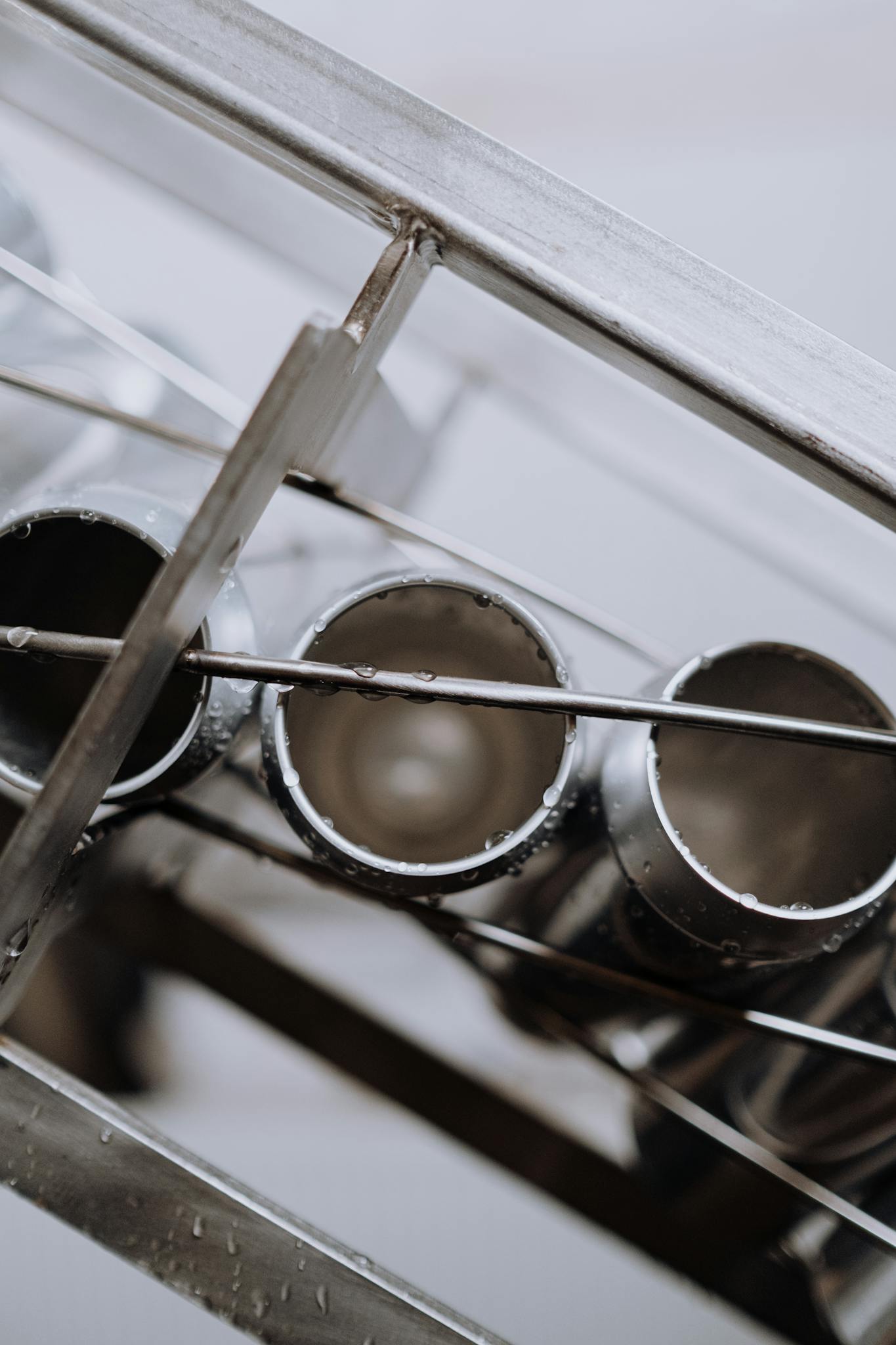 Detailed shot of cans on a production line at a brewery showing automated technology.