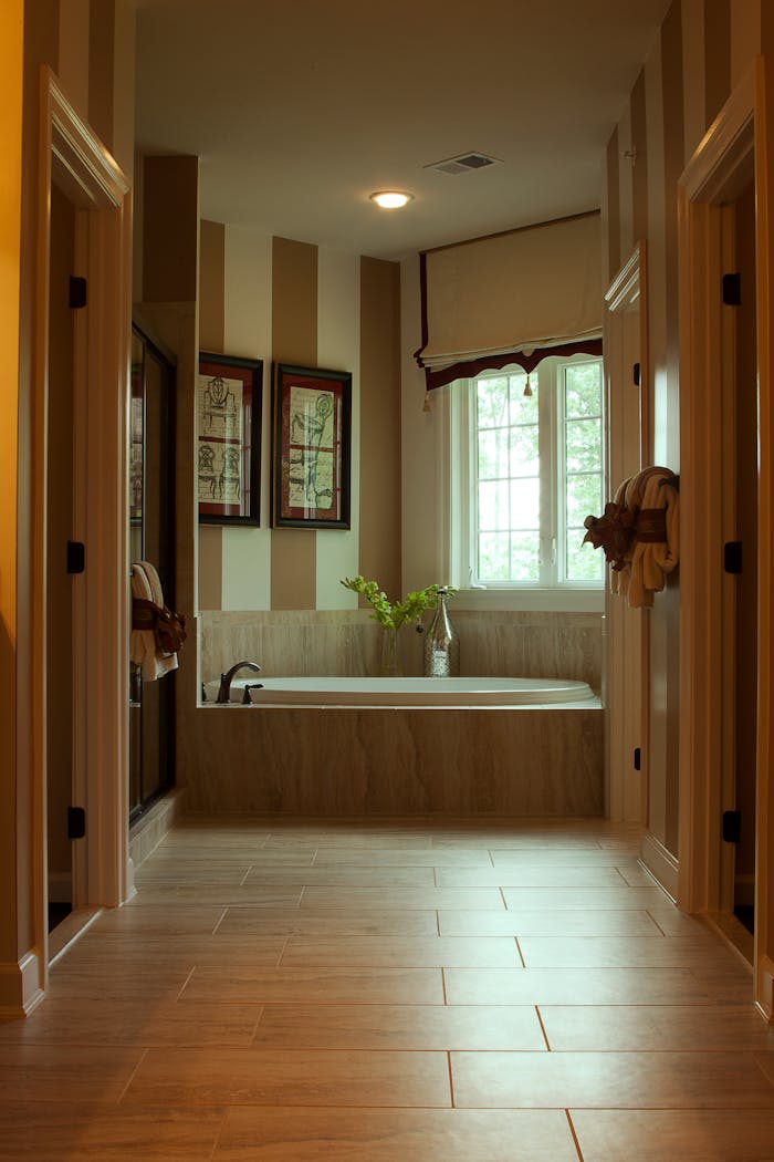 who-we-are Stylish bathroom featuring a modern bathtub and chic interior design.